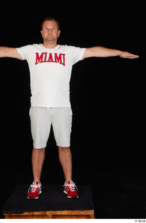 Louis dressed grey shorts red sneakers sports standing t poses…